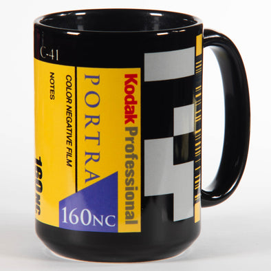 Black mug with Kodak Portra 160NC film canister design on a white background